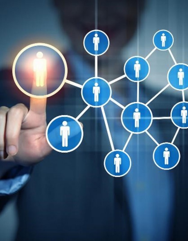Businesspeople applauding a colleague after presentation in the office
